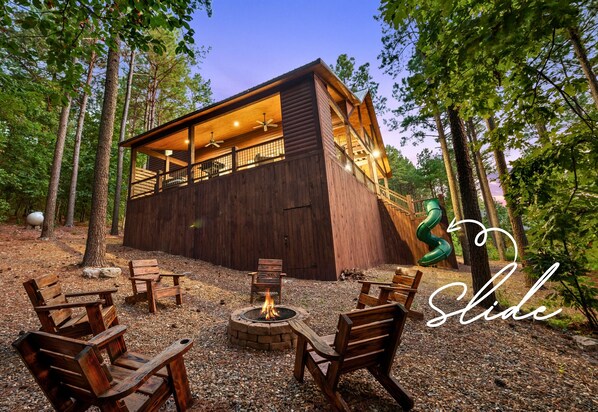 Gather around the fire pit in the evening, where the surrounding trees create a serene backdrop for your conversations.