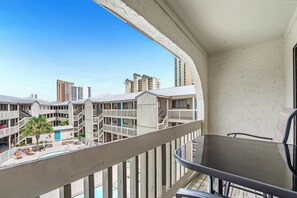Drink your morning coffee out on the private balcony overlooking the pool.