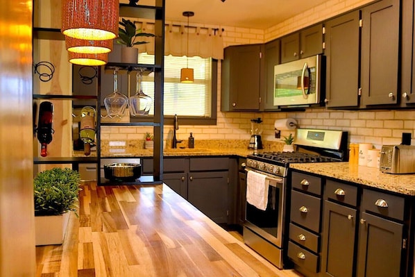 Culinary Delight: Prepare gourmet meals in the well-equipped kitchen, featuring modern appliances, ample counter space, and all the essentials to inspire your inner chef