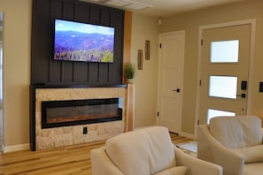 Entertain with Ease: Host intimate gatherings or family movie nights in this inviting space, equipped with a large-screen TV and ample seating to accommodate all your entertainment needs