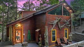 A cabin with a tree on the porch? Yes, please!