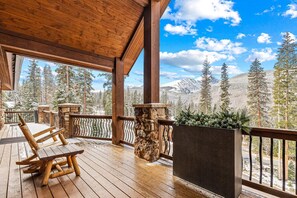 Enjoy the stunning forest and mountain views from the spacious outdoor deck.