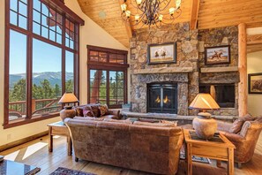 Living room with gas fireplace and great mountain views