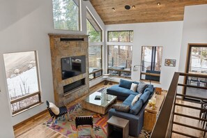 The view from the upstairs over the stylish and cozy living room.