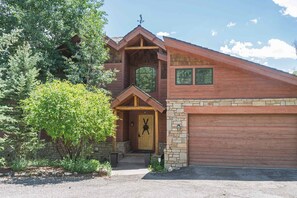 Front entrance: 2 garage parking spaces, 5 driveway/street parking spaces