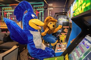 Mascots join the fun in the arcade.