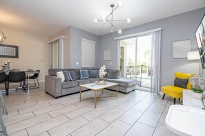Open living space that seamlessly connects the beautiful kitchen and dining area, offering a perfect blend of comfort and style.