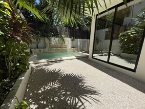 Dive into luxury at our Tulum villa's exquisite pool—an oasis of relaxation and indulgence awaits your perfect getaway