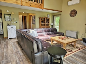 Living area with entry hall in background