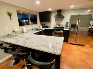 Fully equipped large kitchen with sitting area