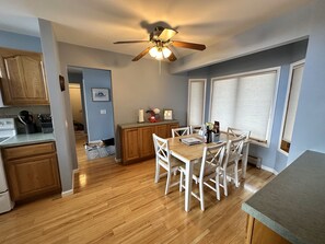 Dinette adjacent to kitchen with seating for 6