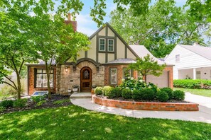 Our classic stone and brick Tudor is situated on a picturesque tree-lined street in Fairway.