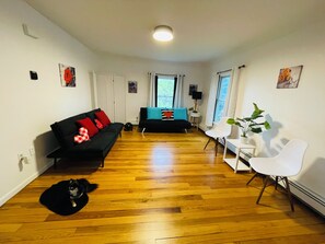 2 futons large open living room wood floors