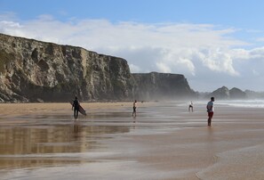 Watergate Bay is renowned for its expansive golden sands framed by cliffs