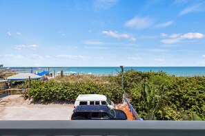 The view from the room overlooks the ocean, beach, and peaks of the Fort Pierce Inlet.