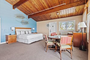 Comfortable rustic charm with vaulted wood ceilings and coastal colors and decor.