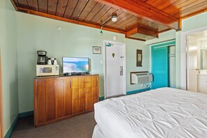 Amenities include a smart TV with cable, a mini fridge, a microwave, and a coffee maker.