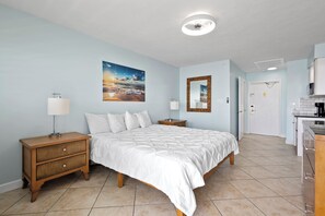 Amenities include a smart TV with cable, a mini fridge, a microwave, and a coffee maker.