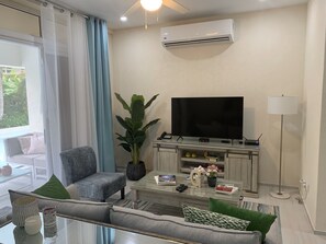 Comfy living room with smart TV and multi-channel cable package
