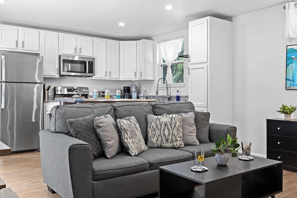 Living Room: Enjoy modern comforts in the eco-friendly ambiance of our home