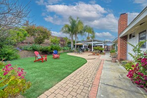 Experience serenity in the backyard oasis, ideal for gatherings & alfresco dining