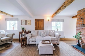 The spacious living room benefits from a 40-inch SMART TV with Netflix on the wall, plenty of space to sit down with family and friends in the evening, and a gorgeous log burner to keep warm in the evenings.