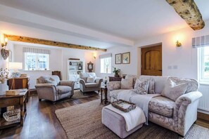 The spacious living room benefits from a 40-inch SMART TV with Netflix on the wall, plenty of space to sit down with family and friends in the evening, and a gorgeous log burner to keep warm in the evenings.