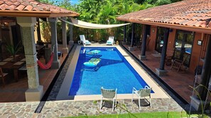 Poolside dining and lounge patios at mid day