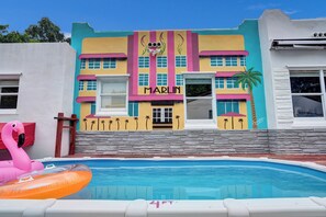 Beautiful mural at the pool deck area, featuring a Vintage Miami ambience