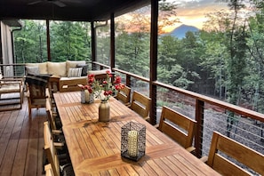The main level screened deck right off the great room is our favorite spot for coffee with a beautiful sunrise mountain view in the morning or drinks and conversation in the evening!
