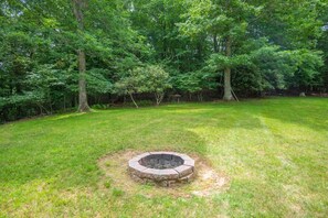Fire pit in backyard of your NC Mountain Cabin Rental!