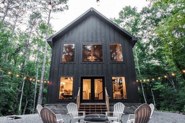 The fire pit behind the cabin is the perfect spot to gather around and relax in the beauty of nature. If you're lucky you'll get to hear the owls that nest on the property having their evening conversations.