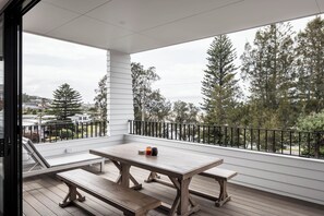 Outdoor seating on deck with waater views