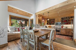 Kitchen and Dining Room: Bright space, 7-person dining table, well-equipped kitchen, French doors to deck