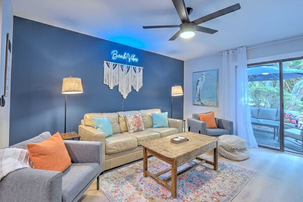 Feel the coastal charm in our cozy living room, illuminated by "beach vibes" lights