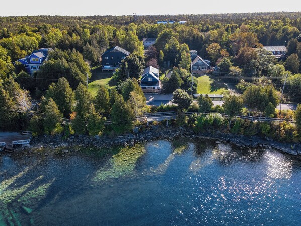 Welcome to Harbourview: Nestled in Tobermory's beautiful coastline. Serene waters and lush greenery surround the cottage.