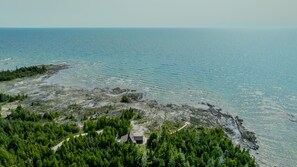 Perched at the tip of the Bruce Peninsula, Lands’ End offers breathtaking aerial views of Lake Huron—just minutes from Tobermory and iconic local attractions.