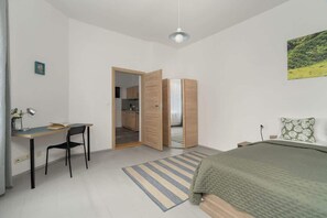 Bedroom with a desk.