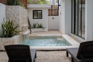 Dive into luxury at our Tulum villa's exquisite pool—an oasis of relaxation and indulgence awaits your perfect getaway