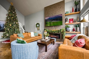 Step into a luxurious haven where elegance meets holiday cheer! Our thoughtfully decorated living area is designed for comfort and relaxation, featuring cozy seating and warm, festive touches that make it the ideal spot to unwind.