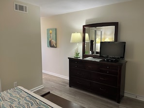 A well-equipped bedroom with a TV for easy entertainment