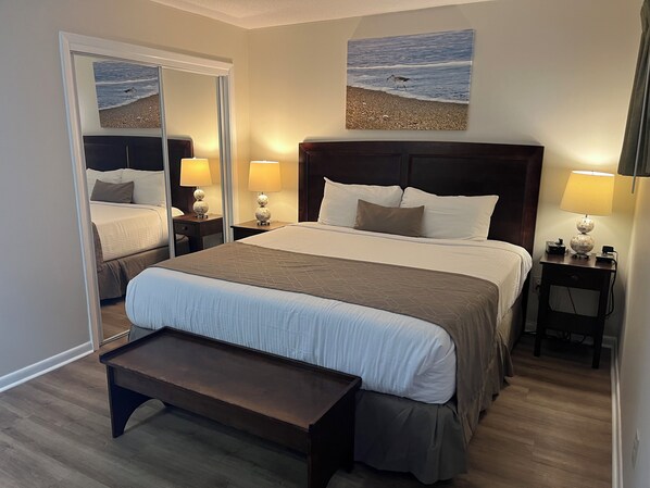 spacious bedroom with a king-size bed