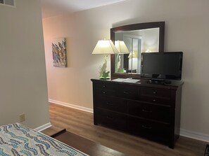 well-equipped bedroom with a TV for easy entertainment