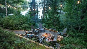 Enjoy the soft glow above the new firepit as you toast marshmallows