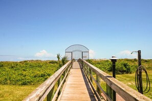 Take a stroll down our private beach walk