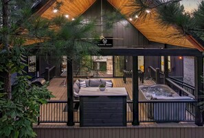 Discover pure tranquility on this breathtaking patio nestled among towering pines, offering warmth, serenity, and unparalleled privacy for your scenic outdoor retreat.