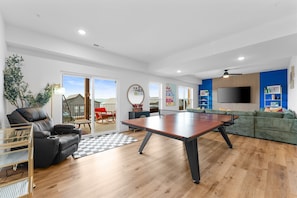 Such a fun family room! Massaging Recliner + Ping Pong + Family Room + Back Deck