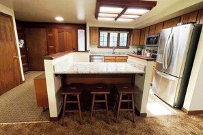 Kitchen works well for entertaining while preparing meals