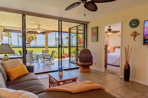 Living room with views of ocean and front row to golf.