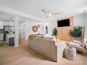 Who needs art on the walls when you can hang a surfboard from the ceiling? Living the beach life indoors! 🏄‍♂️ #HomeSurfVibes